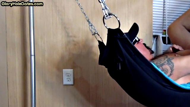 Tattooed daddy in sling gets fucked in ass at home