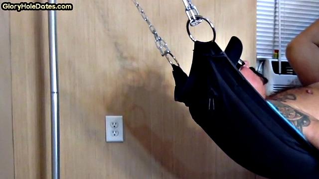 Tattooed daddy in sling gets fucked in ass at home