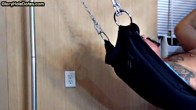 Tattooed daddy in sling gets fucked in ass at home