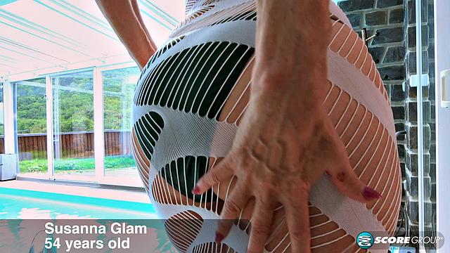 A red-hot 54-year-old's tiny bikini and pussy show