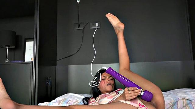 Lil Mia Holds the Vibrator with Shaved Pussy Closeup