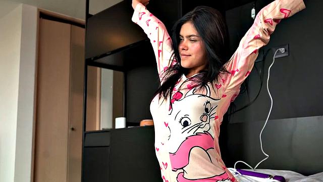 Lil Mia Holds the Vibrator with Shaved Pussy Closeup