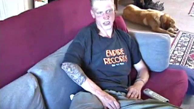 Freckled face Brandon invites us to watch him beat off, which really turns him on. The pants strip off and an anal toy goes in while he keeps stroking along through it all.