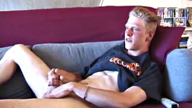 Freckled face Brandon invites us to watch him beat off, which really turns him on. The pants strip off and an anal toy goes in while he keeps stroking along through it all.