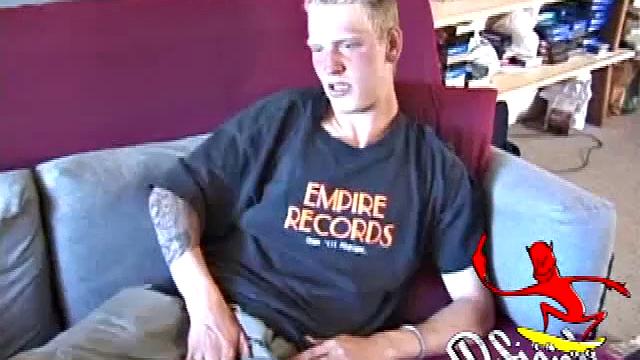 Freckled face Brandon invites us to watch him beat off, which really turns him on. The pants strip off and an anal toy goes in while he keeps stroking along through it all.