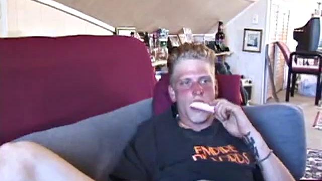 Freckled face Brandon invites us to watch him beat off, which really turns him on. The pants strip off and an anal toy goes in while he keeps stroking along through it all.