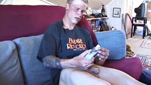 Freckled face Brandon invites us to watch him beat off, which really turns him on. The pants strip off and an anal toy goes in while he keeps stroking along through it all.