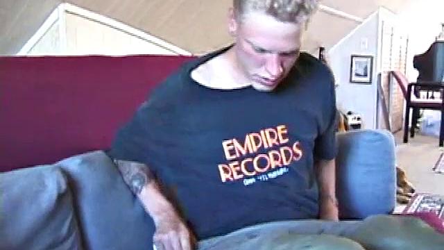 Freckled face Brandon invites us to watch him beat off, which really turns him on. The pants strip off and an anal toy goes in while he keeps stroking along through it all.