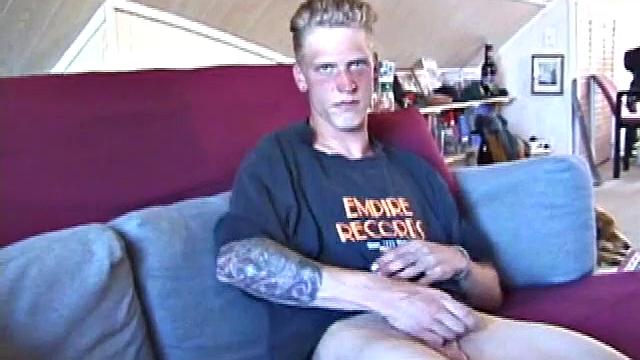 Freckled face Brandon invites us to watch him beat off, which really turns him on. The pants strip off and an anal toy goes in while he keeps stroking along through it all.