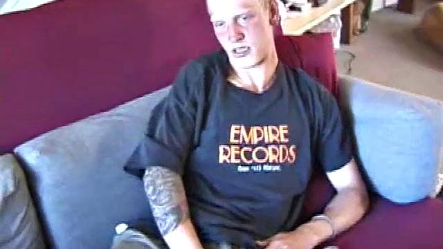 Freckled face Brandon invites us to watch him beat off, which really turns him on. The pants strip off and an anal toy goes in while he keeps stroking along through it all.