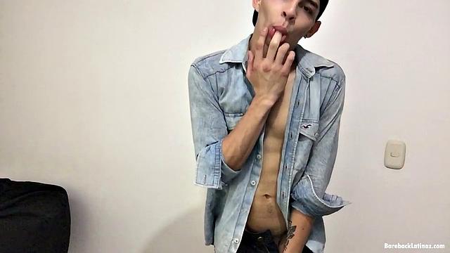 Paul leans against a wall, opens his shirt and pushes down his pants to reveal a skinny and smooth body and big uncut dick. Then he gives us a look at his little butt, while fingering himself, before stripping naked.