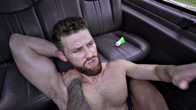 Tattooed hunk barebacks his tattooed friend in the van - hot, raw, and steamy!