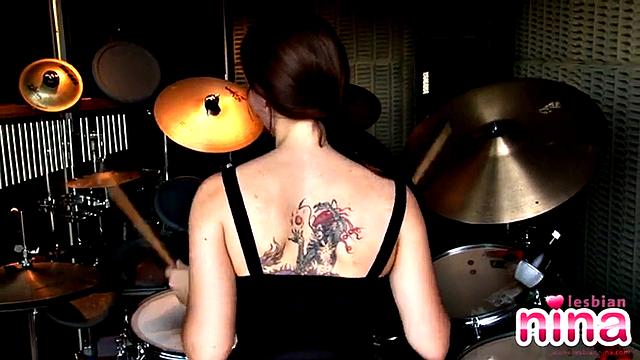 Tattooed lesbian masturbates