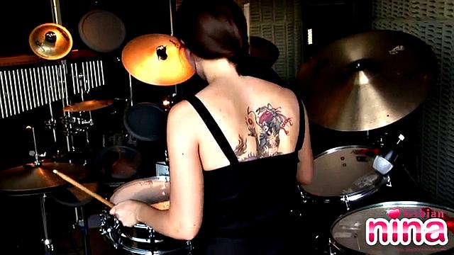 Tattooed lesbian masturbates