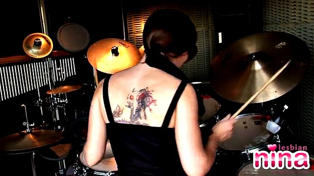 Tattooed lesbian masturbates