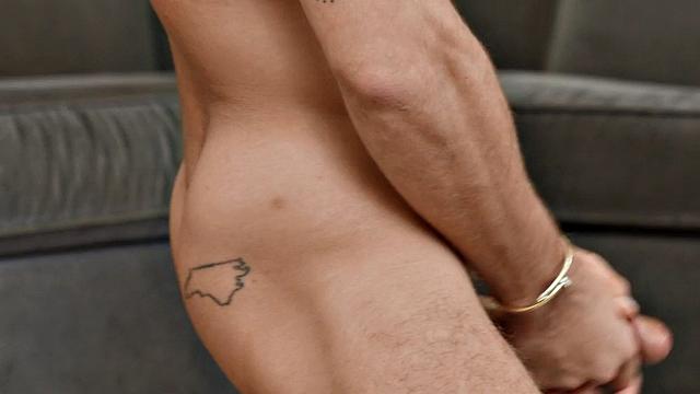 Solo inked eager jock wanks his cock with pleasure