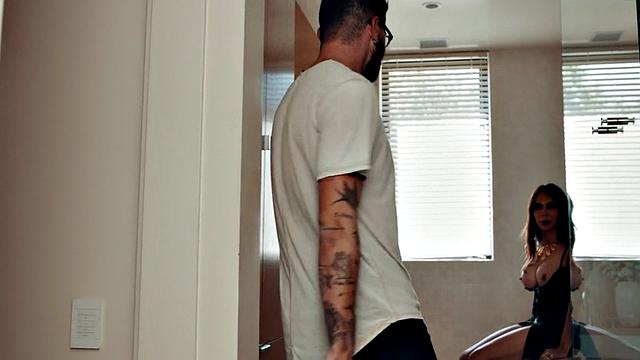 Trans milf sucking bf in bathroom while showing off tits