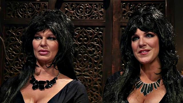 Lezdom toying submissive with dildo while rubbing