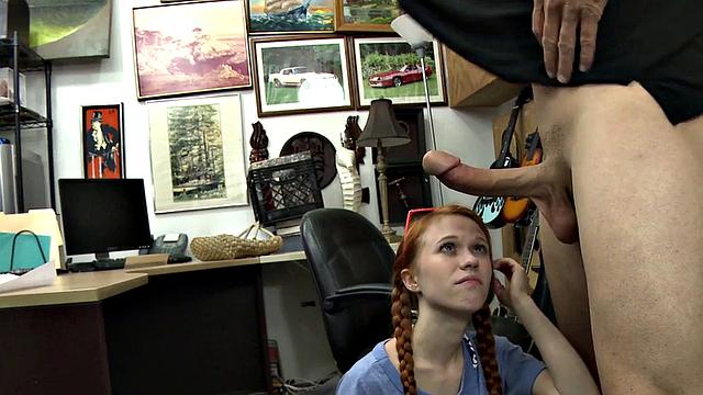 Sexy redhead bitch sucks big white dick at pawnshop