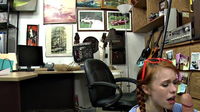Sexy redhead bitch sucks big white dick at pawnshop