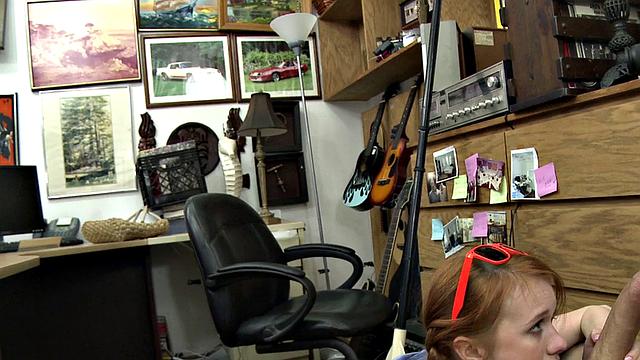 Sexy redhead bitch sucks big white dick at pawnshop