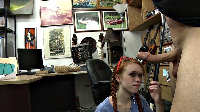 Sexy redhead bitch sucks big white dick at pawnshop