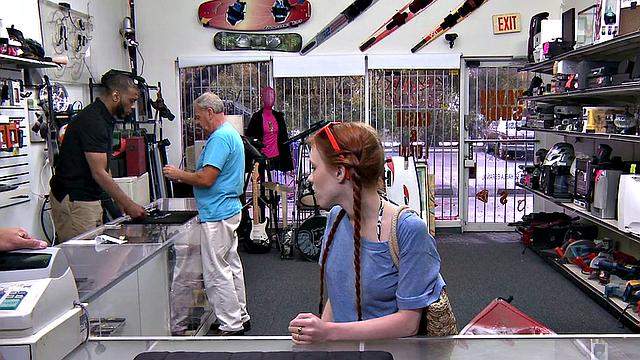 Sexy redhead bitch sucks big white dick at pawnshop