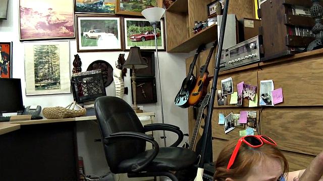 Sexy redhead bitch sucks big white dick at pawnshop
