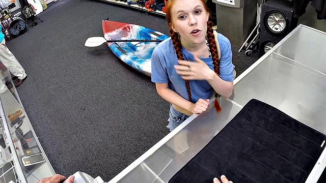 Sexy redhead bitch sucks big white dick at pawnshop