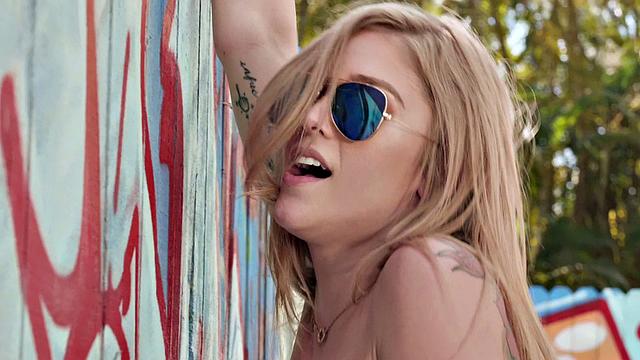 Blonde hottie with pierced pussy goes wild in denim jeans and gives a handjob in reverse cowgirl position