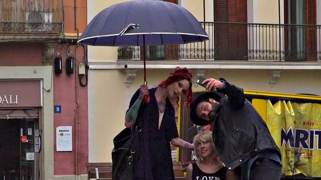 Lezdom redhead MILF shows teen servant outdoors in public