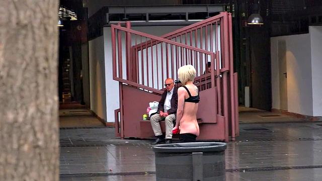 Lezdom redhead MILF shows teen servant outdoors in public