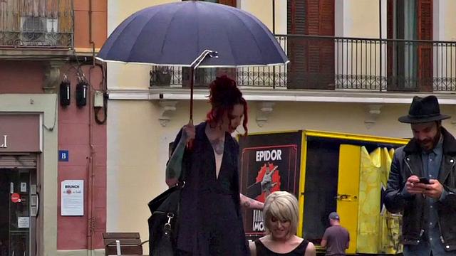 Lezdom redhead MILF shows teen servant outdoors in public