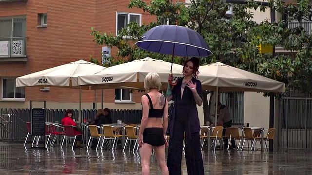 Lezdom redhead MILF shows teen servant outdoors in public