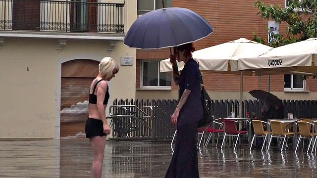 Lezdom redhead MILF shows teen servant outdoors in public