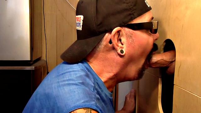 Gray gaydaddy giving head and tug to gloryhole top