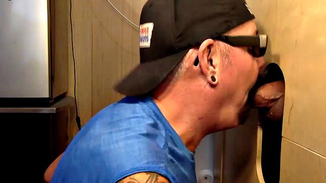 Gray gaydaddy giving head and tug to gloryhole top