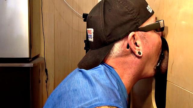 Gray gaydaddy giving head and tug to gloryhole top