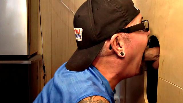 Gray gaydaddy giving head and tug to gloryhole top