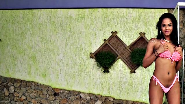 Watch this naughty brunette tgirl strip & tease before jerking off & ass-toying in the pool