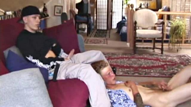 Brandon sits on the floor and rubs the growing bulge in his pants while he watches some bimbos on the TV. Shane comes up the stairs and notices that Brandon is already hard at work and sits down on the couch behind him.