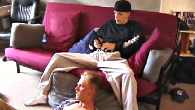 Brandon sits on the floor and rubs the growing bulge in his pants while he watches some bimbos on the TV. Shane comes up the stairs and notices that Brandon is already hard at work and sits down on the couch behind him.