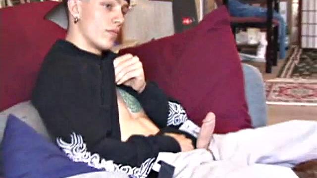 Brandon sits on the floor and rubs the growing bulge in his pants while he watches some bimbos on the TV. Shane comes up the stairs and notices that Brandon is already hard at work and sits down on the couch behind him.