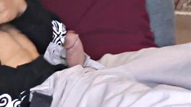 Brandon sits on the floor and rubs the growing bulge in his pants while he watches some bimbos on the TV. Shane comes up the stairs and notices that Brandon is already hard at work and sits down on the couch behind him.