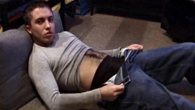 Johnny Johnson starts a porn video. Revealing his hairy chest, this young man sticks his hand down his jeans and massages his cock. This boy has big arms and a big dick that he loves to show off.