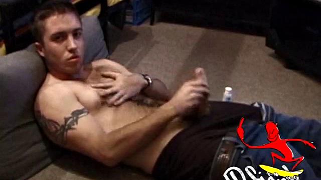 Johnny Johnson starts a porn video. Revealing his hairy chest, this young man sticks his hand down his jeans and massages his cock. This boy has big arms and a big dick that he loves to show off.