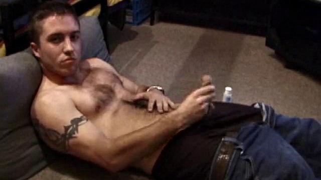 Johnny Johnson starts a porn video. Revealing his hairy chest, this young man sticks his hand down his jeans and massages his cock. This boy has big arms and a big dick that he loves to show off.