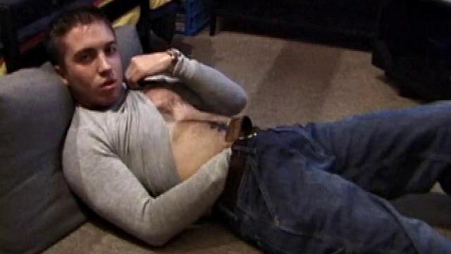 Johnny Johnson starts a porn video. Revealing his hairy chest, this young man sticks his hand down his jeans and massages his cock. This boy has big arms and a big dick that he loves to show off.