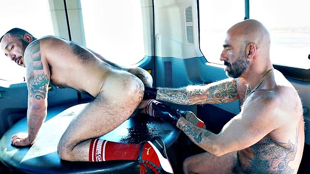 Fisting hunk with gloves fists hairy hole in van