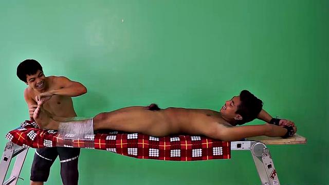 Hot and sexy Asian gay boy Josh discovers his kink as he is strapped down on the tickle rack for a session he won't soon forget. Josh discovers he loves being tickled, and begins to fantasize about being in a dungeon.